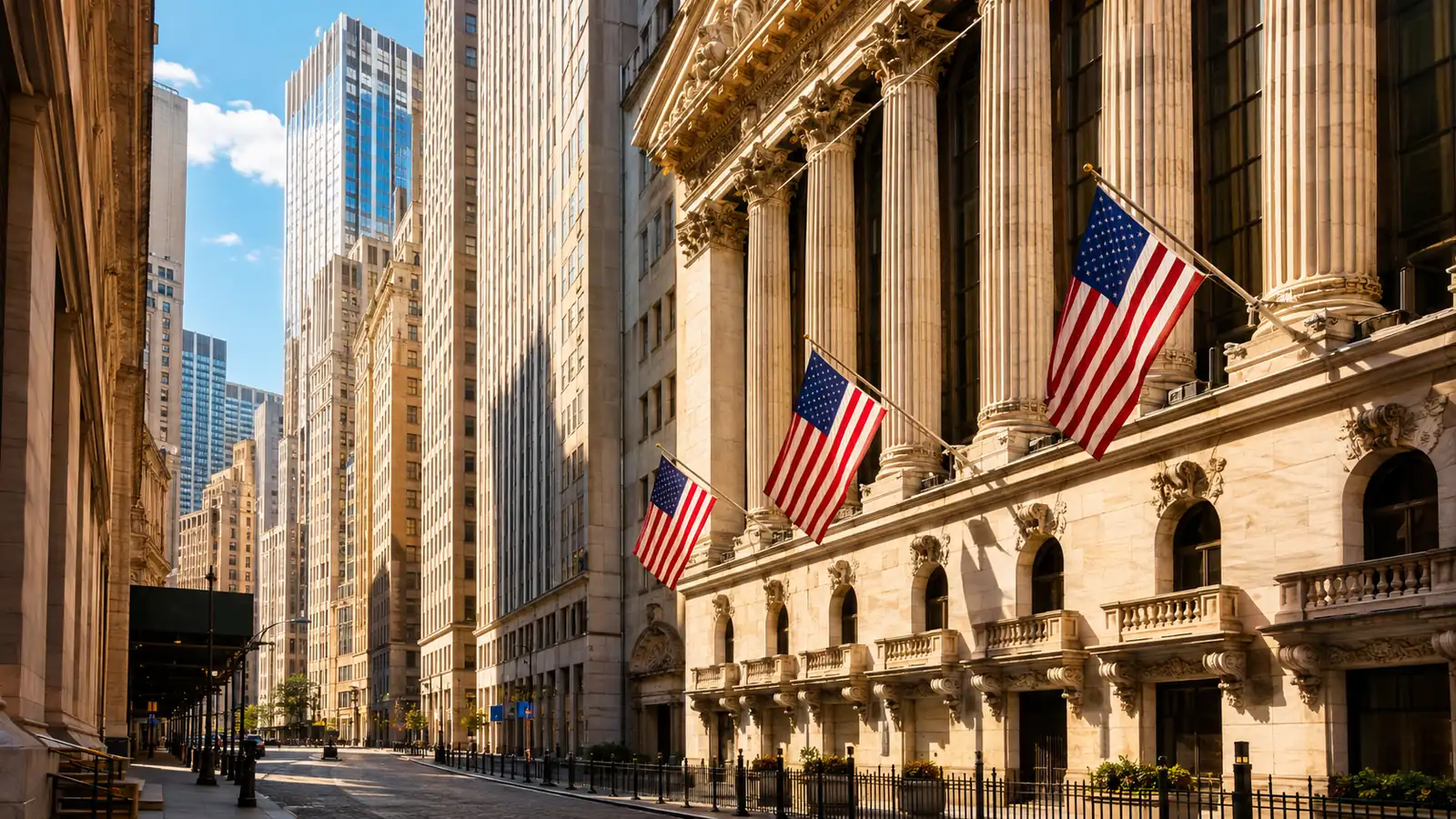 Classical stone columns and flags on a stock exchange facade in warm afternoon light above a wide street